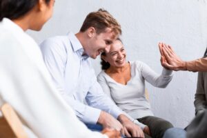 smiley-people-group-therapy-session-high-fiving-each-other_23-2148752085